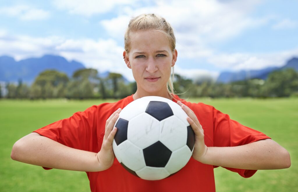 Getting focused for the game. Portrait of a determined young female soccer player.